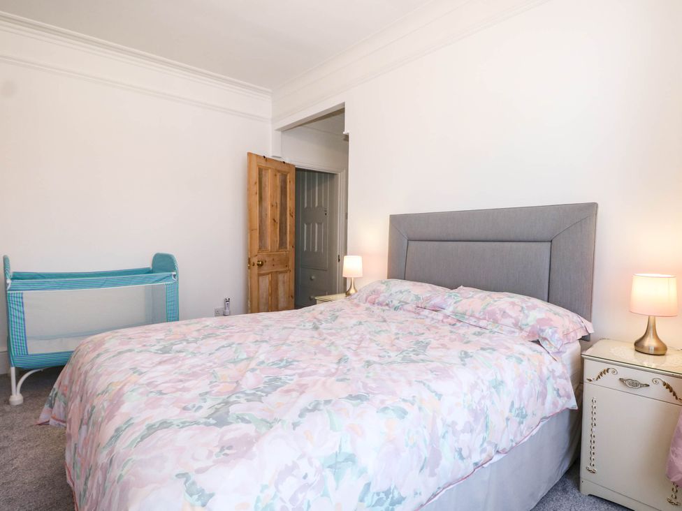 A bedroom with a bed and crib at Fernleigh in Margate