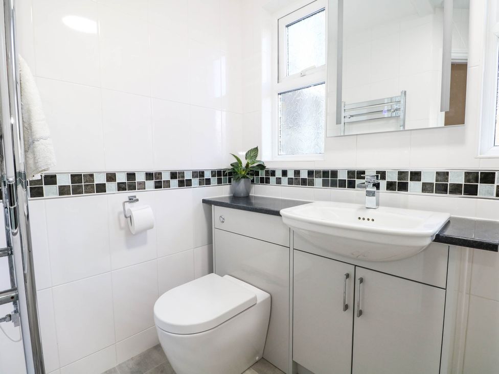 A bathroom with a sink and toilet at Fernleigh in Margate