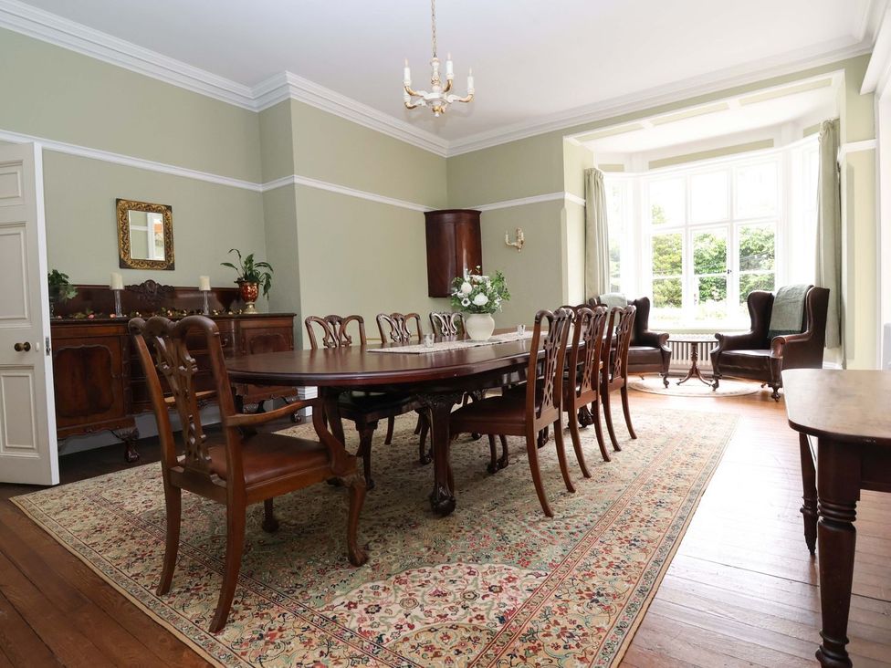 A dining room with a large table and chairs at Parkfields House in Stoke-on-Trent