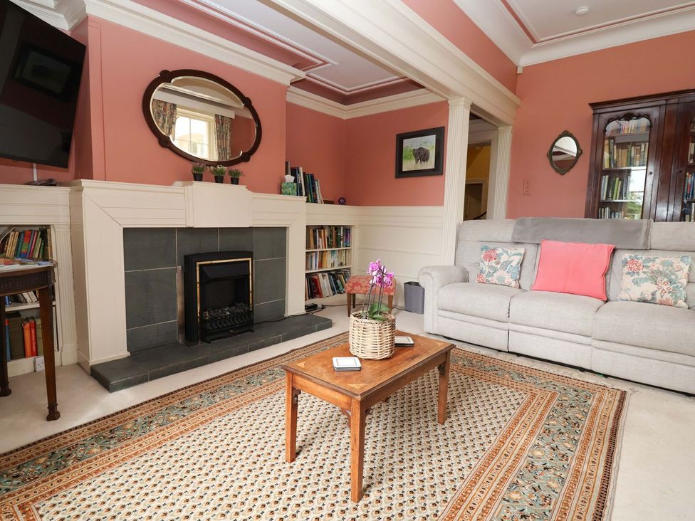 A living room with a sofa and coffee table at Parkfields House Stoke-on-Trent