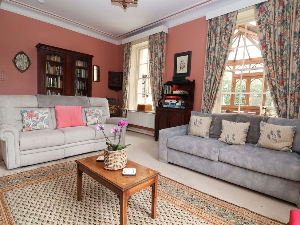 A living room with sofas and a coffee table at Parkfields House in Stoke-on-Trent