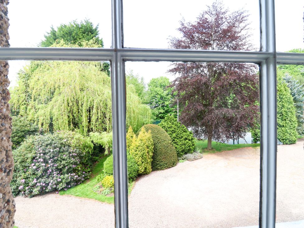 A view of a garden and driveway from a window at Parkfields House Stoke-on-Trent