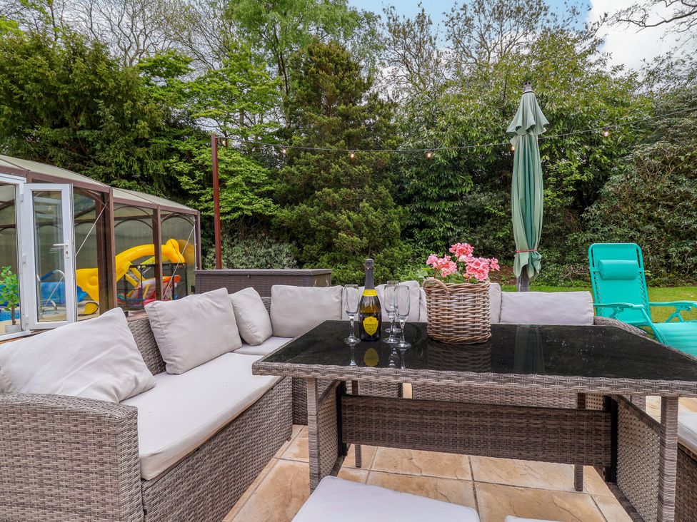 A garden with furniture and a table at Parkfields House Stoke-on-Trent