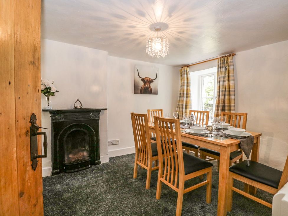 A dining room with a table and chairs at Brigg House Broughton-in-Furness