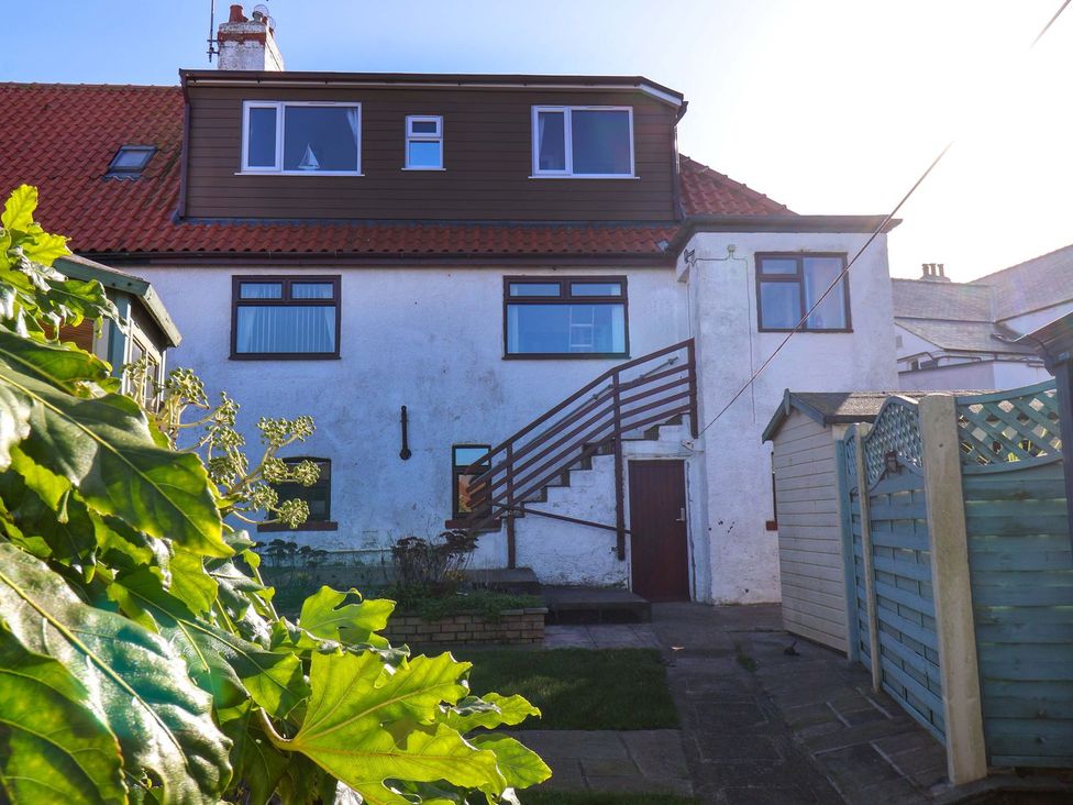 A house with stairs leading to the upper floor at Beachcrest Whitby