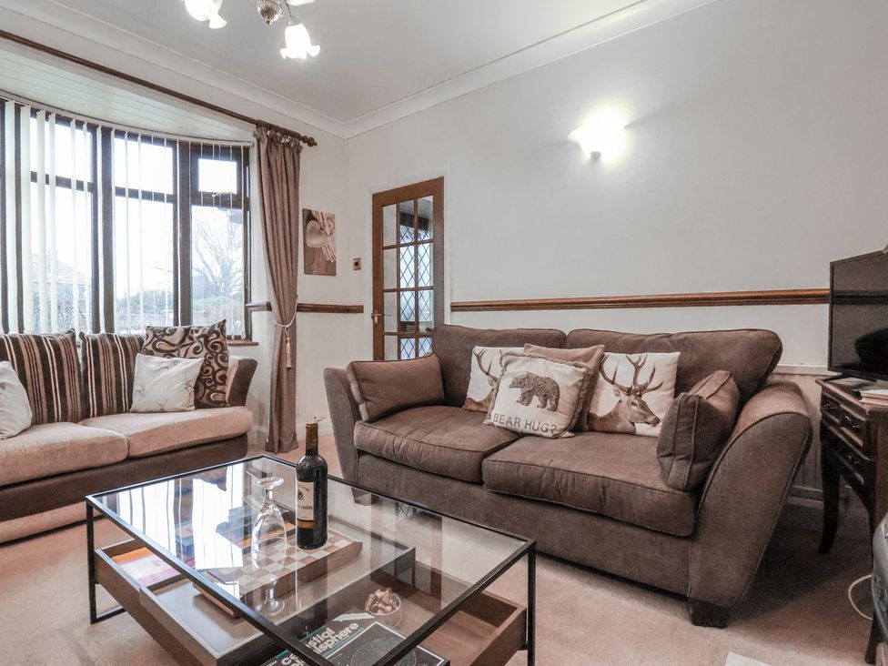 A living room with sofas and a coffee table at Beachcrest in Whitby