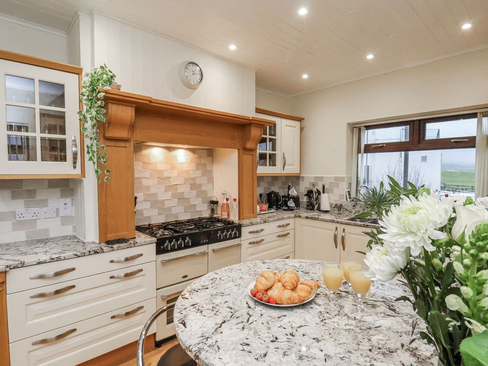 A kitchen with a gas stove and croissants on the counter at Beachcrest in Whitby