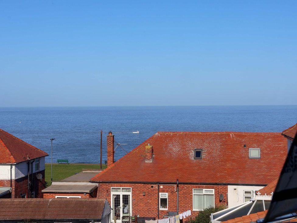 A view of rooftops and the sea at Beachcrest in Whitby