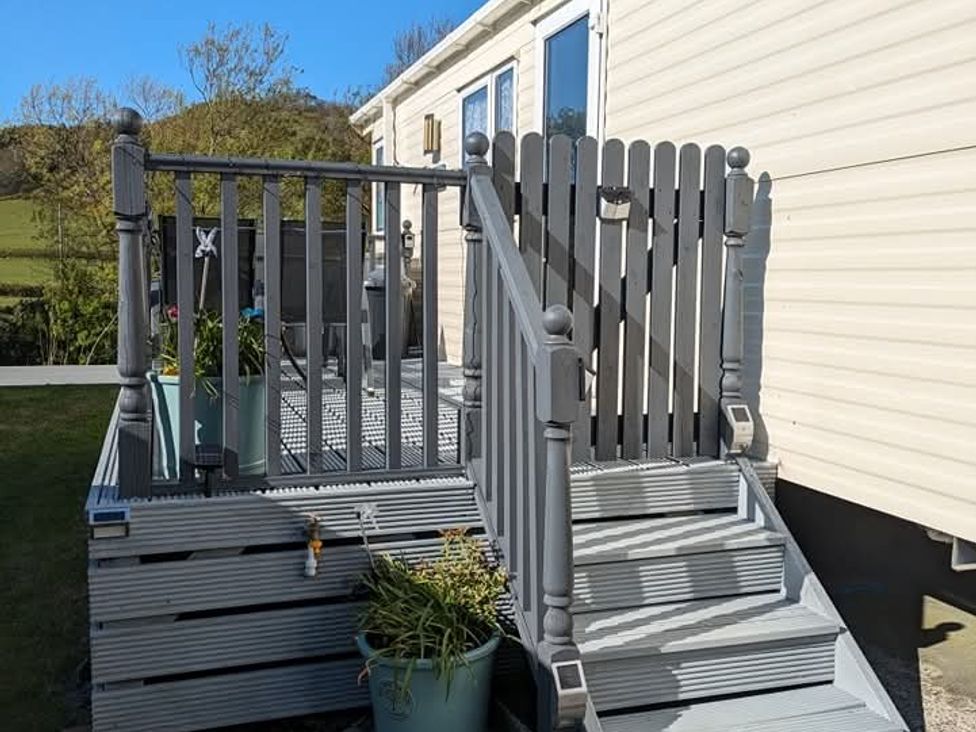 A staircase leading to a deck at Clarach Bay Holiday Village W18 Aberystwyth