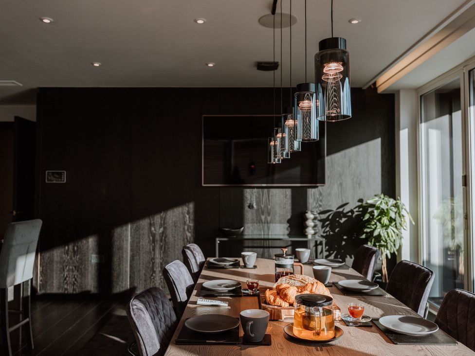 A dining room with a table set for breakfast at The Penthouse in Shrewsbury