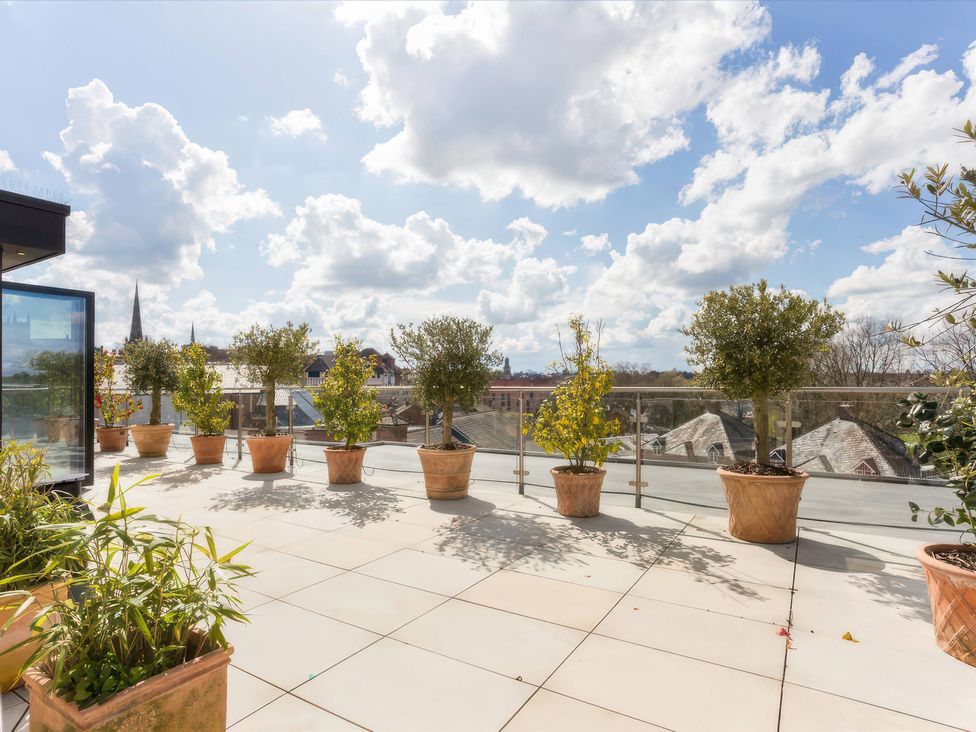 A balcony with potted plants and a view at The Penthouse in Shrewsbury
