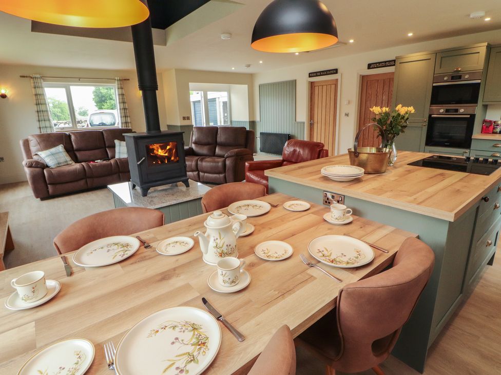 A dining room with a table set for tea at Beckdale in Settle