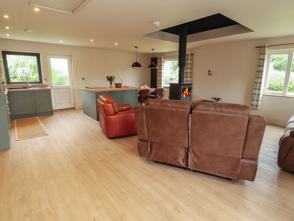A living room with a sofa and fireplace at Beckdale in Settle