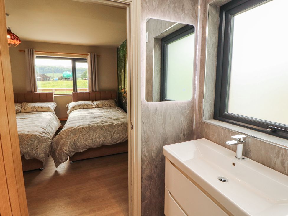 A bedroom with two beds and a view at Beckdale in Settle