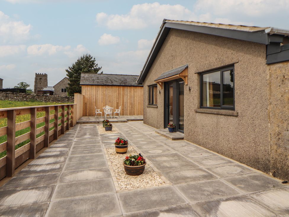 An outdoor area with a house and patio at Beckdale in Settle