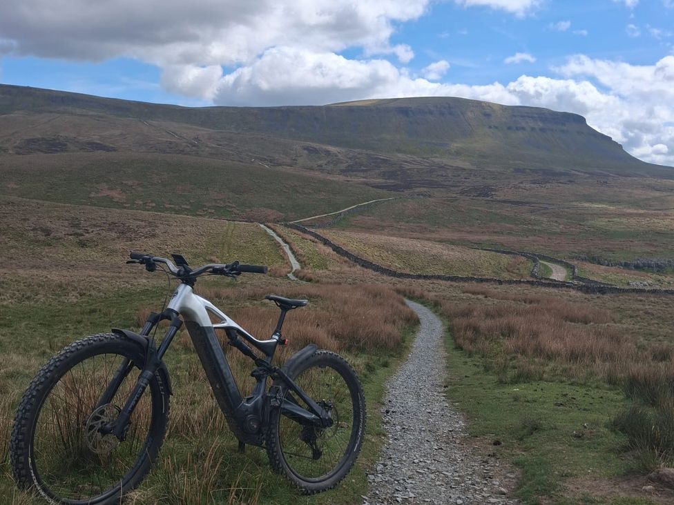 A bicycle on a dirt path in a grassy area at Beckdale Horton-in-Ribblesdale near Settle
