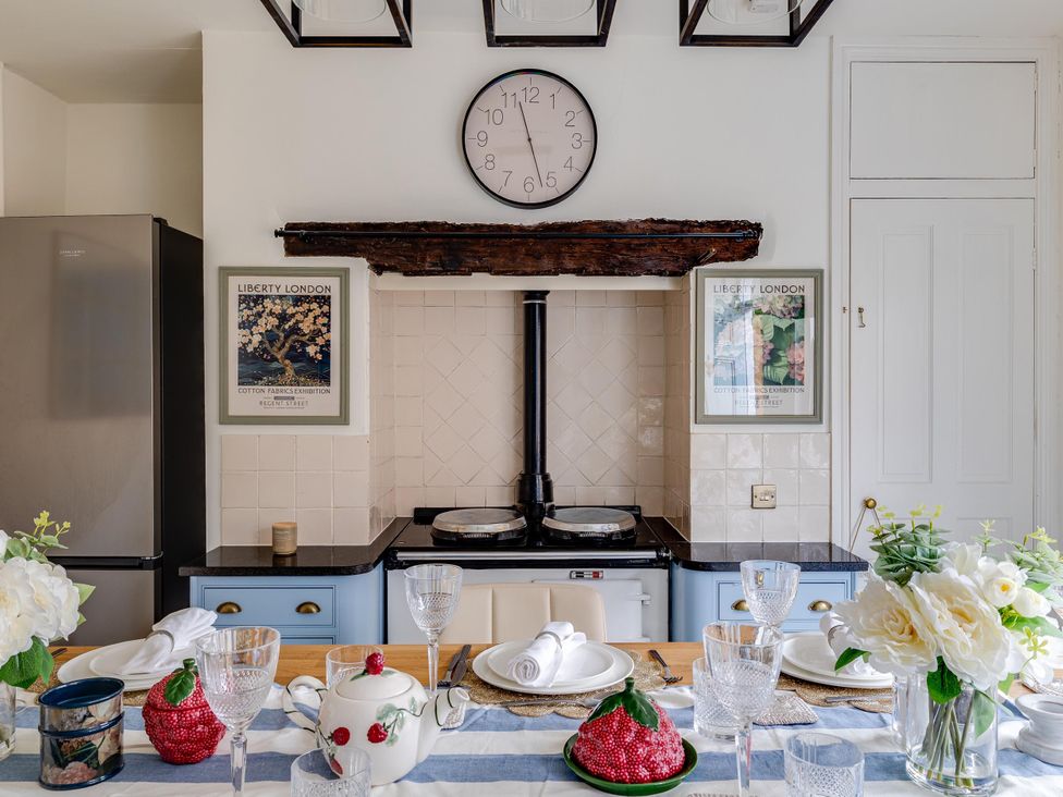 A kitchen with a stove and refrigerator at Luxury Georgian Townhouse / sleeps 10 / parking