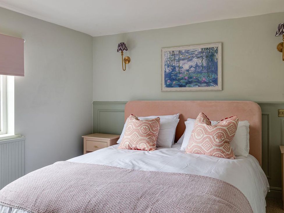 A bedroom with a bed and painting at Luxury Georgian Townhouse / sleeps 10 / parking 