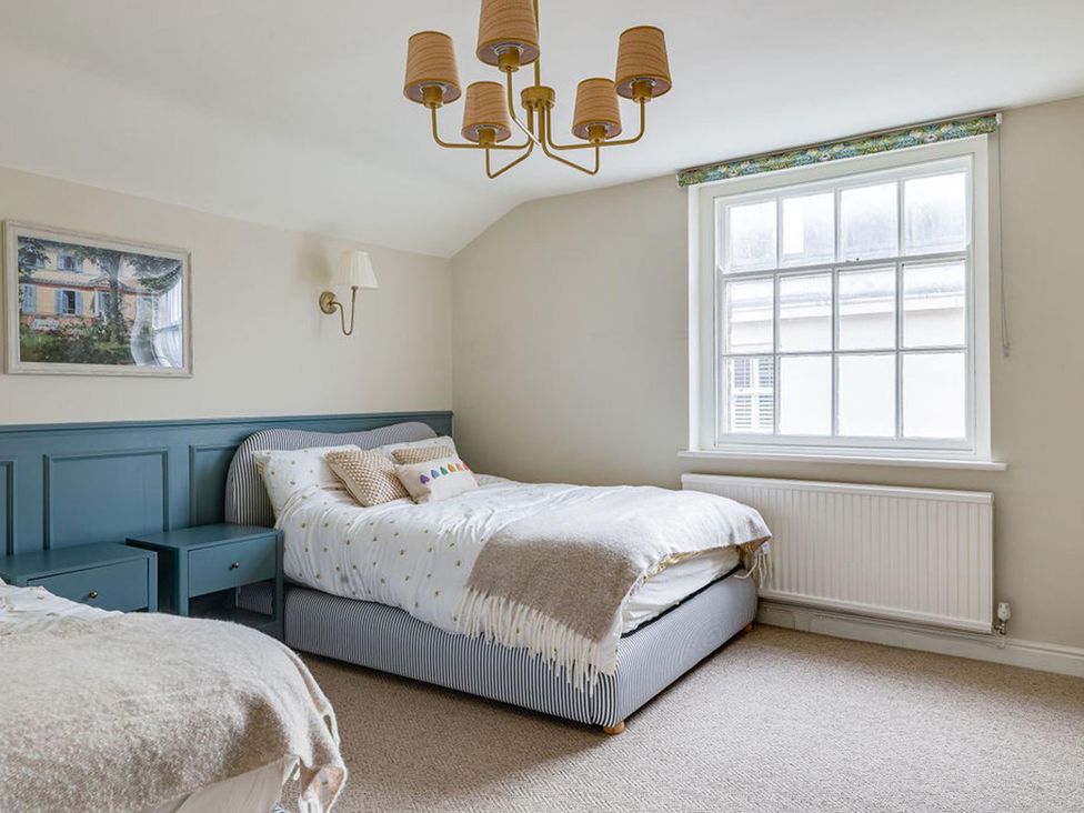 A bedroom with two beds and a window at Luxury Georgian Townhouse / sleeps 10 / parking