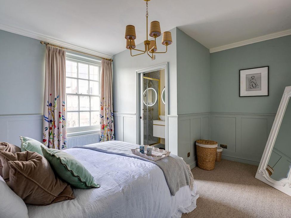 A bedroom with a bed and window at Luxury Georgian Townhouse / sleeps 10 / parking