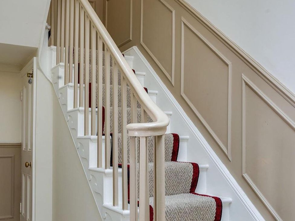 A staircase leading to upper floors at Luxury Georgian Townhouse / sleeps 10 / parking 