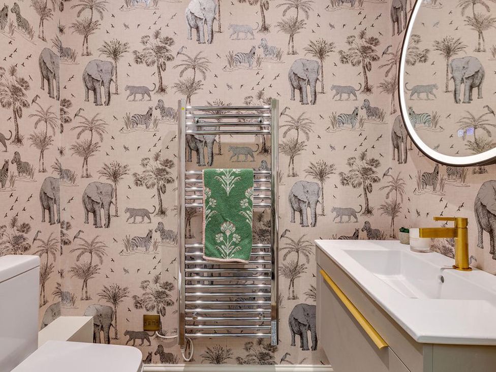 A bathroom with a towel warmer and a sink at Luxury Georgian Townhouse / sleeps 10 / parking
