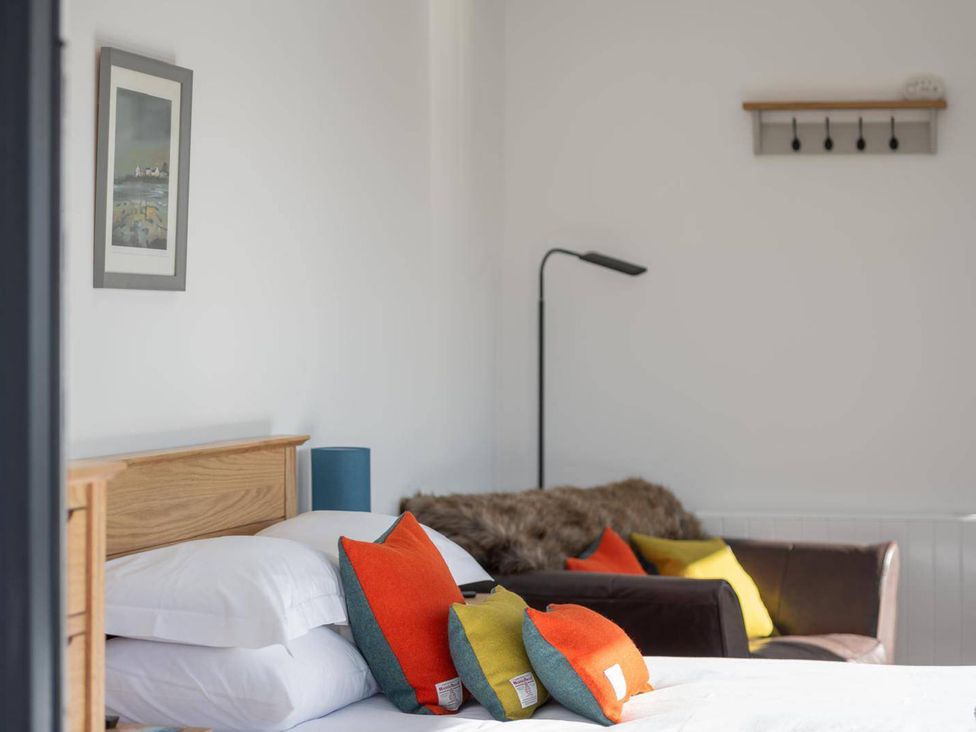 A bedroom with a bed and lamp at Migdale Heights - Luxury Cabins in The Highlands