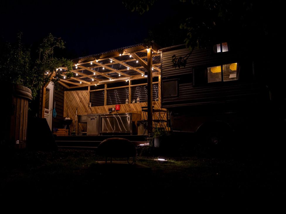 An outdoor kitchen area with lights at 1 Bed Vehicle Luxury Camper -Hot Tub, Pets - Willy near Mill Lane Farmhouse