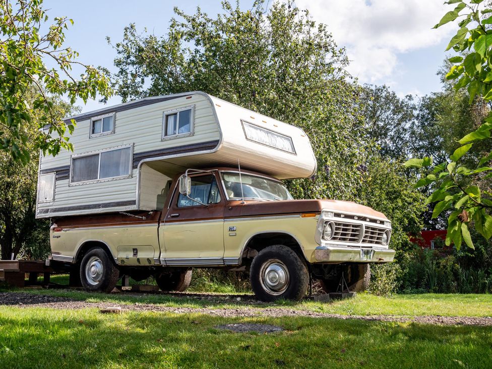 A truck with a camper on top at 1 Bed Vehicle Luxury Camper -Hot Tub, Pets - Willy, Mill Lane Farmhouse near Burgh Le Marsh