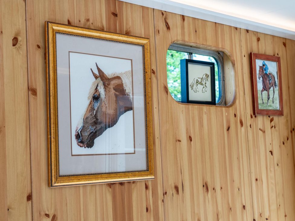 Artwork of horses on a wooden wall at 1 Bed -Private Garden -Hot Tub -Pets Ok - Gee Gee