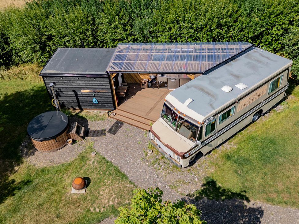An outdoor area with a hot tub and a mobile home at Sleeps 2 -Pets Welcome -Private Hot Tub -Alabama