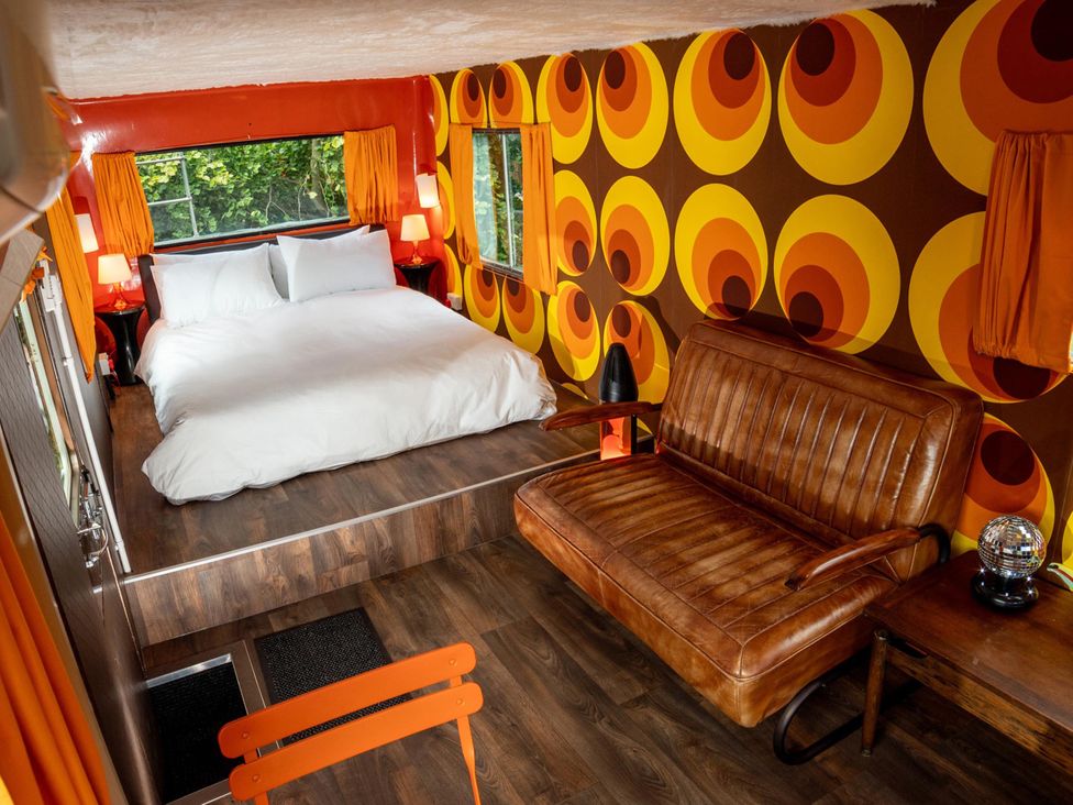 A bedroom with a bed and sofa at Sleeps 2 -Pets Welcome -Private Hot Tub -Alabama