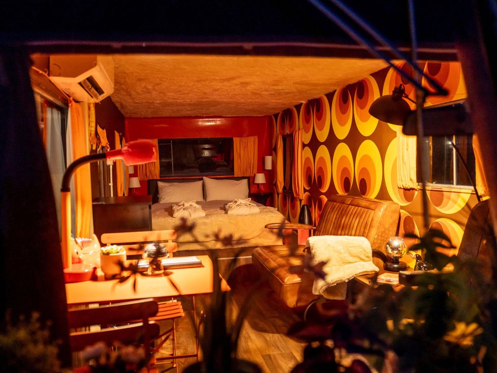 A bedroom with a bed and sofa at Sleeps 2 -Pets Welcome -Private Hot Tub -Alabama