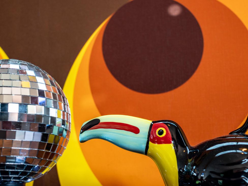 A disco ball and toucan figurine at Sleeps 2 -Pets Welcome -Private Hot Tub -Alabama