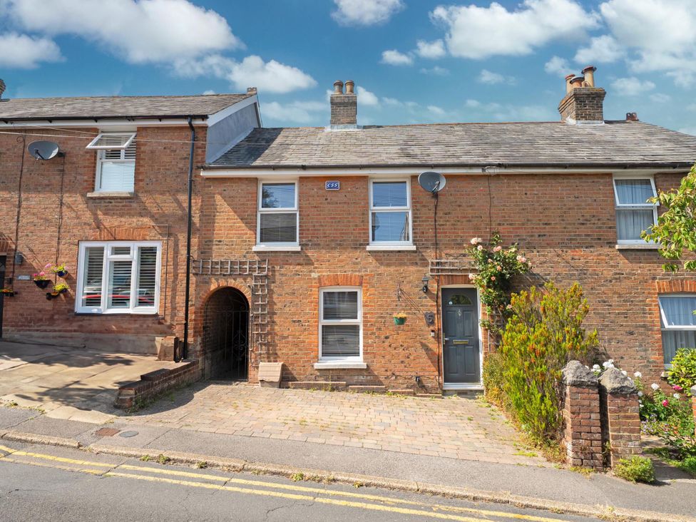A brick house with windows and a door at 3 Bed House - Sleeps 5 - Garden - Pets - Parking
