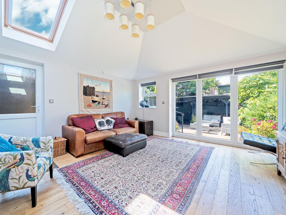 A living room with a sofa and armchair at 3 Bed House - Sleeps 5 - Garden - Pets - Parking 