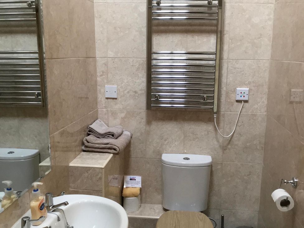 A bathroom with a sink and toilet at 