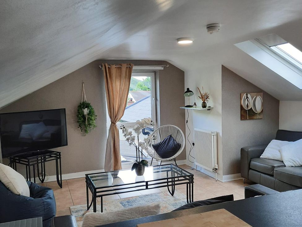 A living room with a television and a coffee table at the property