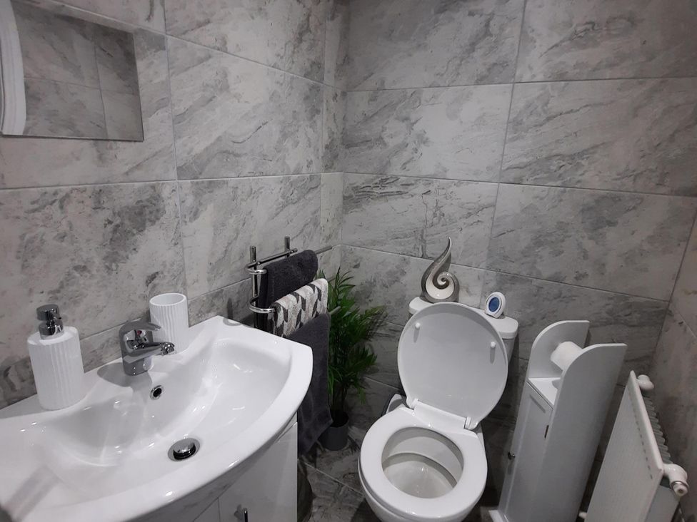 A bathroom with a sink and toilet at the property