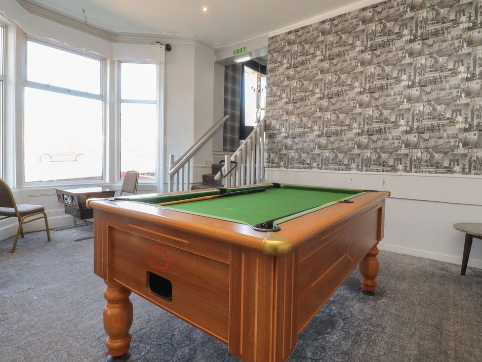A game room with a pool table and a staircase at Luxury Winter Gardens Apartment 1 in Blackpool