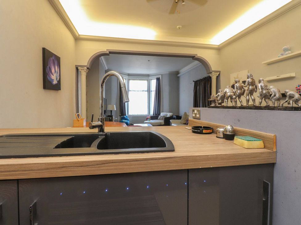 A kitchen with a sink and faucet at Luxury Winter Gardens Apartment 2, Blackpool