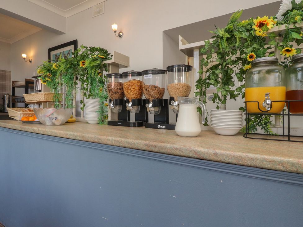 A breakfast area with cereal dispensers and milk jug at Luxury Winter Gardens Apartment 2 Blackpool