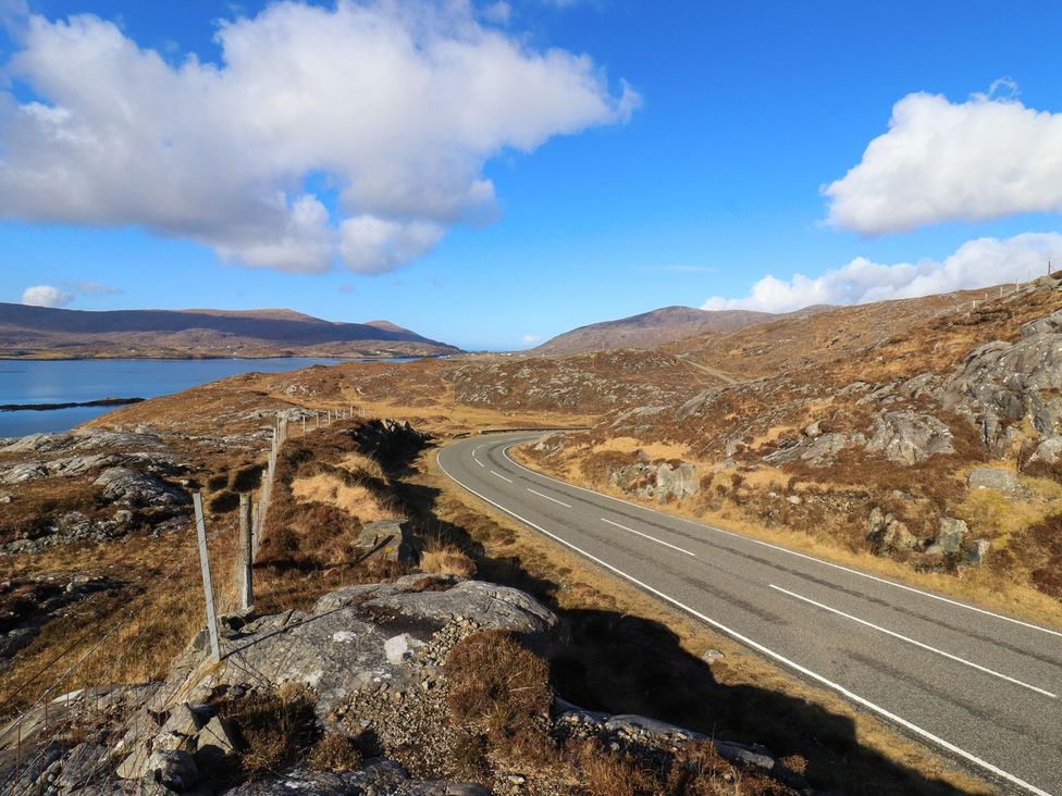 A road winding through a landscape at 8B Carrigreich on the Isle of Harris