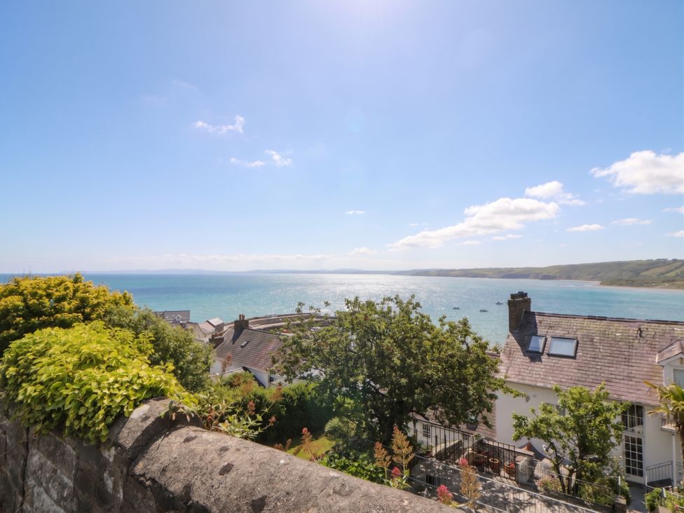 An outdoor view of the sea and houses at Arosfa New Quay
