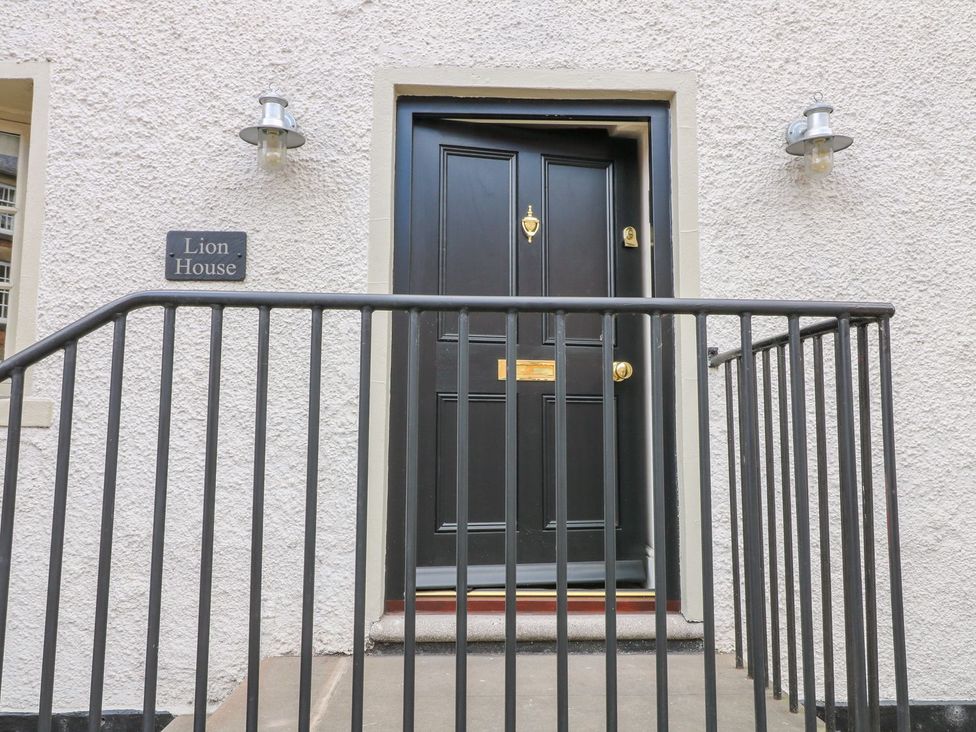 An entrance with a black door and nameplate at Lion House in Ashbourne