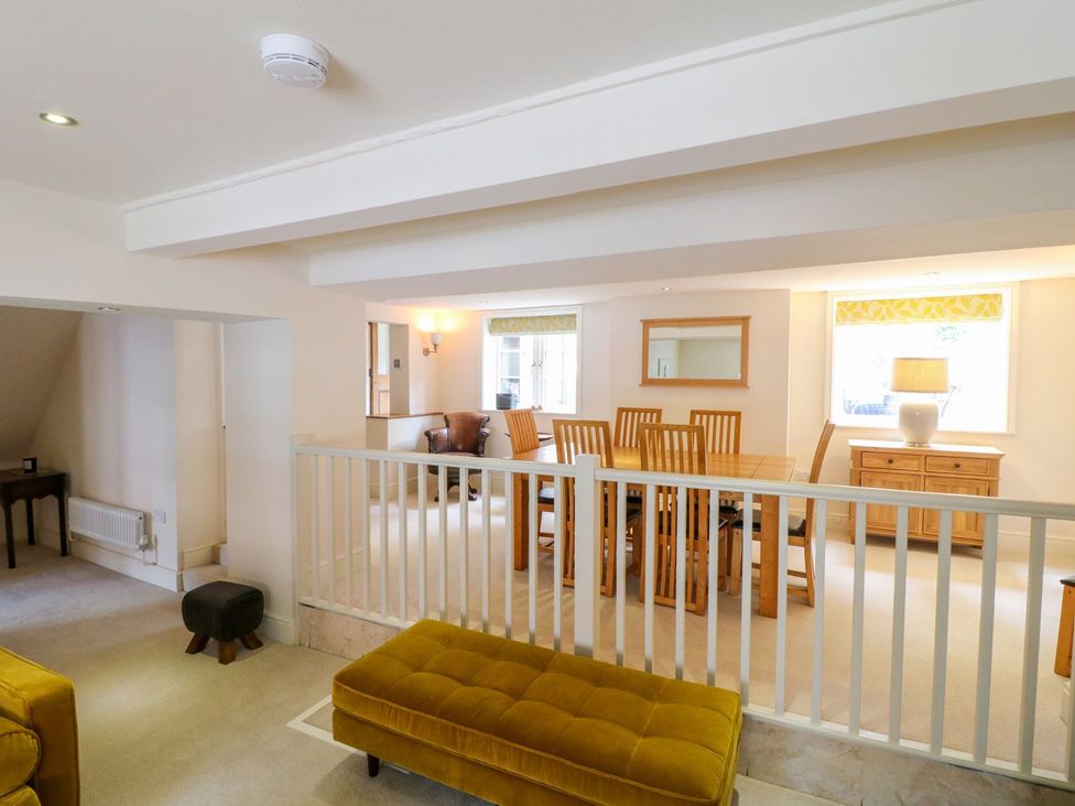 A living room with a dining area and a sofa at Lion House in Ashbourne