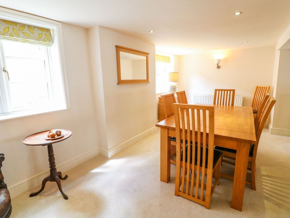 A dining room with a table and chairs at Lion House in Ashbourne