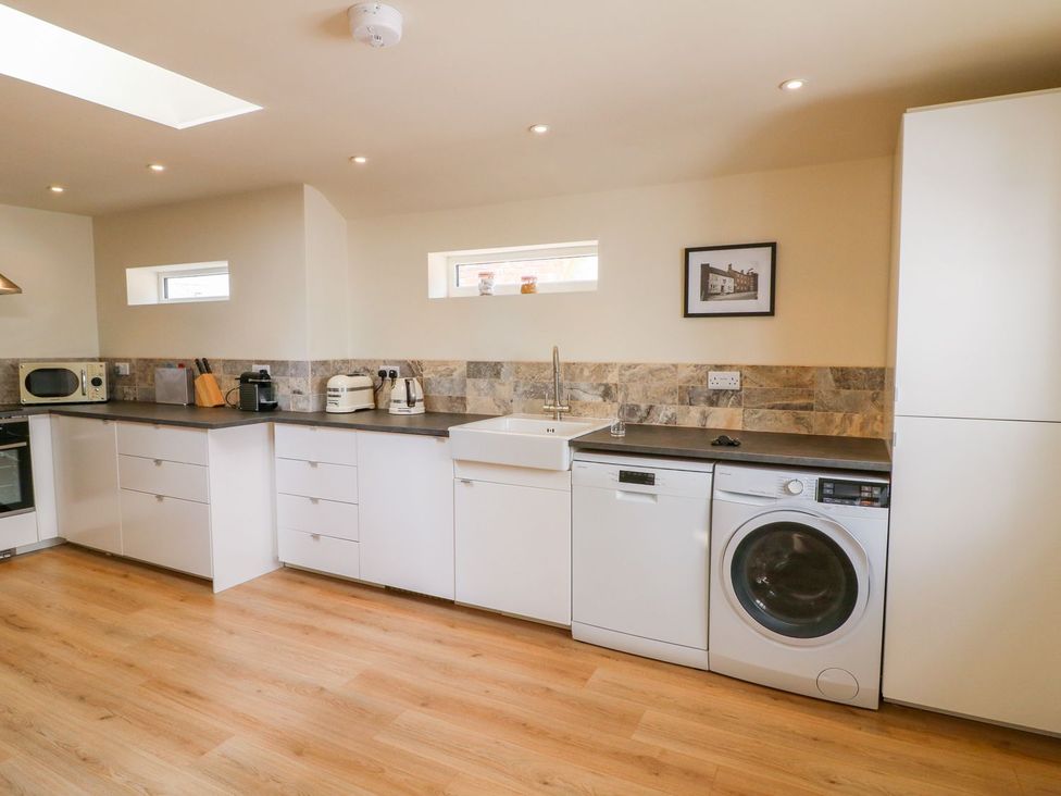 A kitchen with appliances and a sink at Lion House in Ashbourne