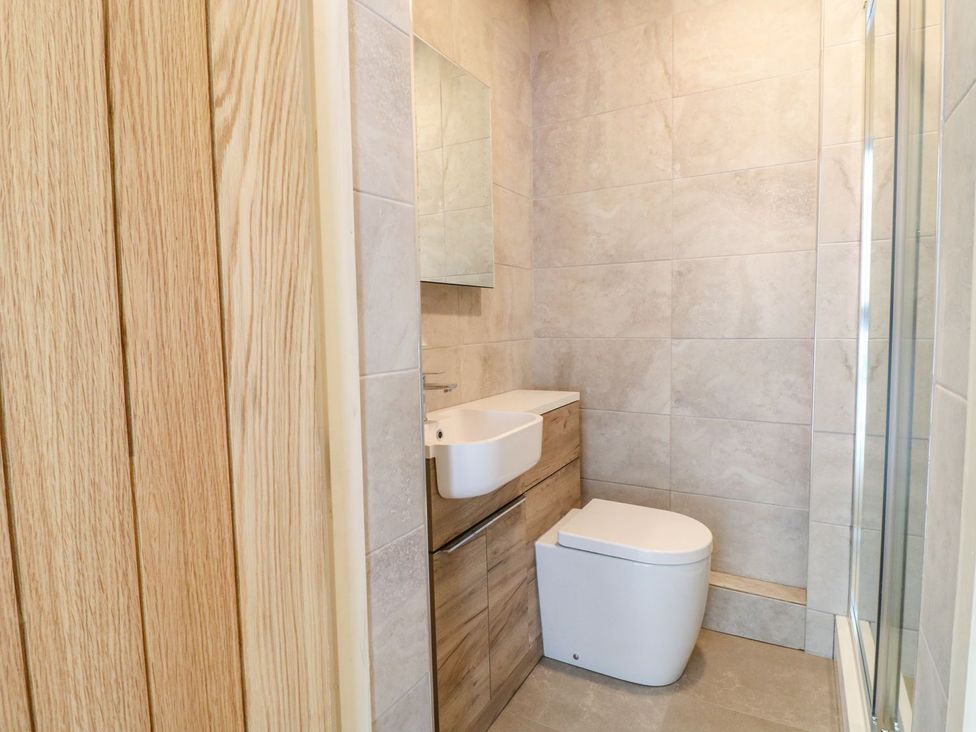 A bathroom with a sink and toilet at Lion House in Ashbourne