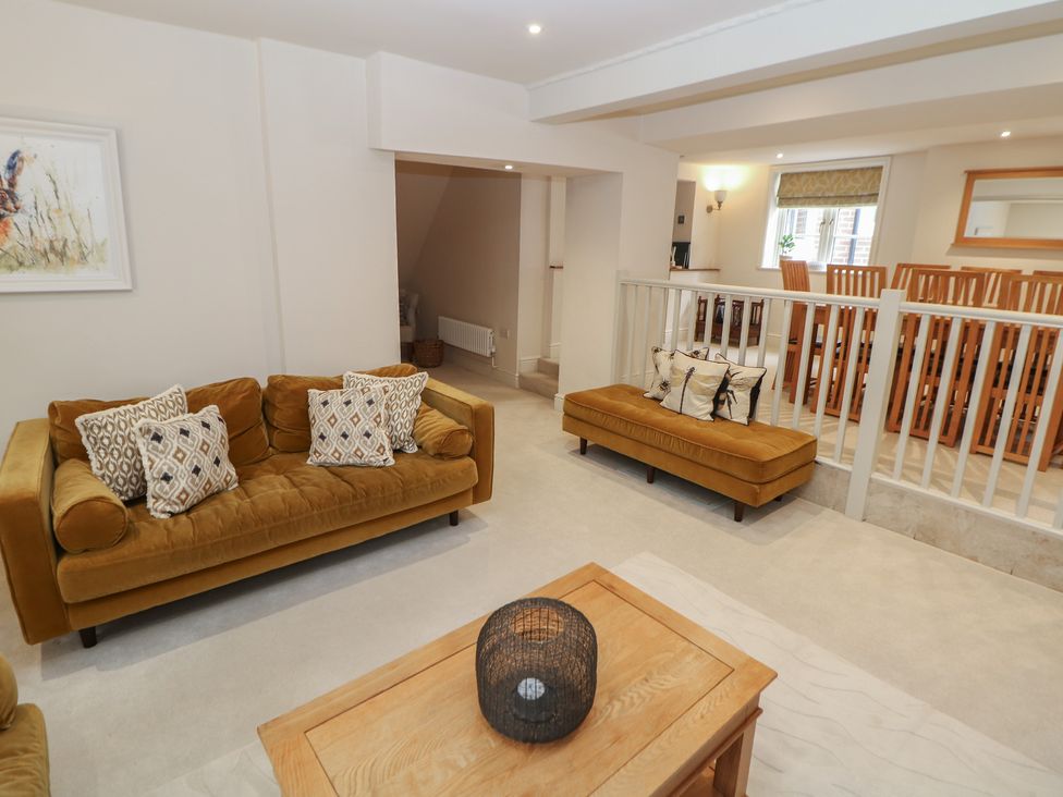 A living room with a sofa and coffee table at Lion House in Ashbourne